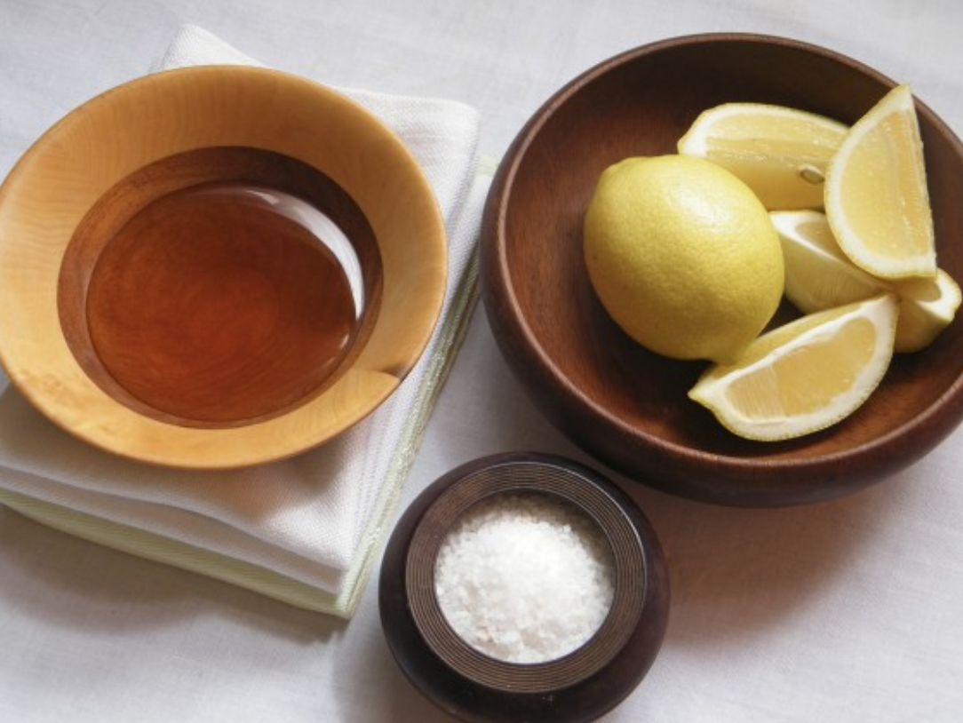A table with bowls of lemon and sugar.